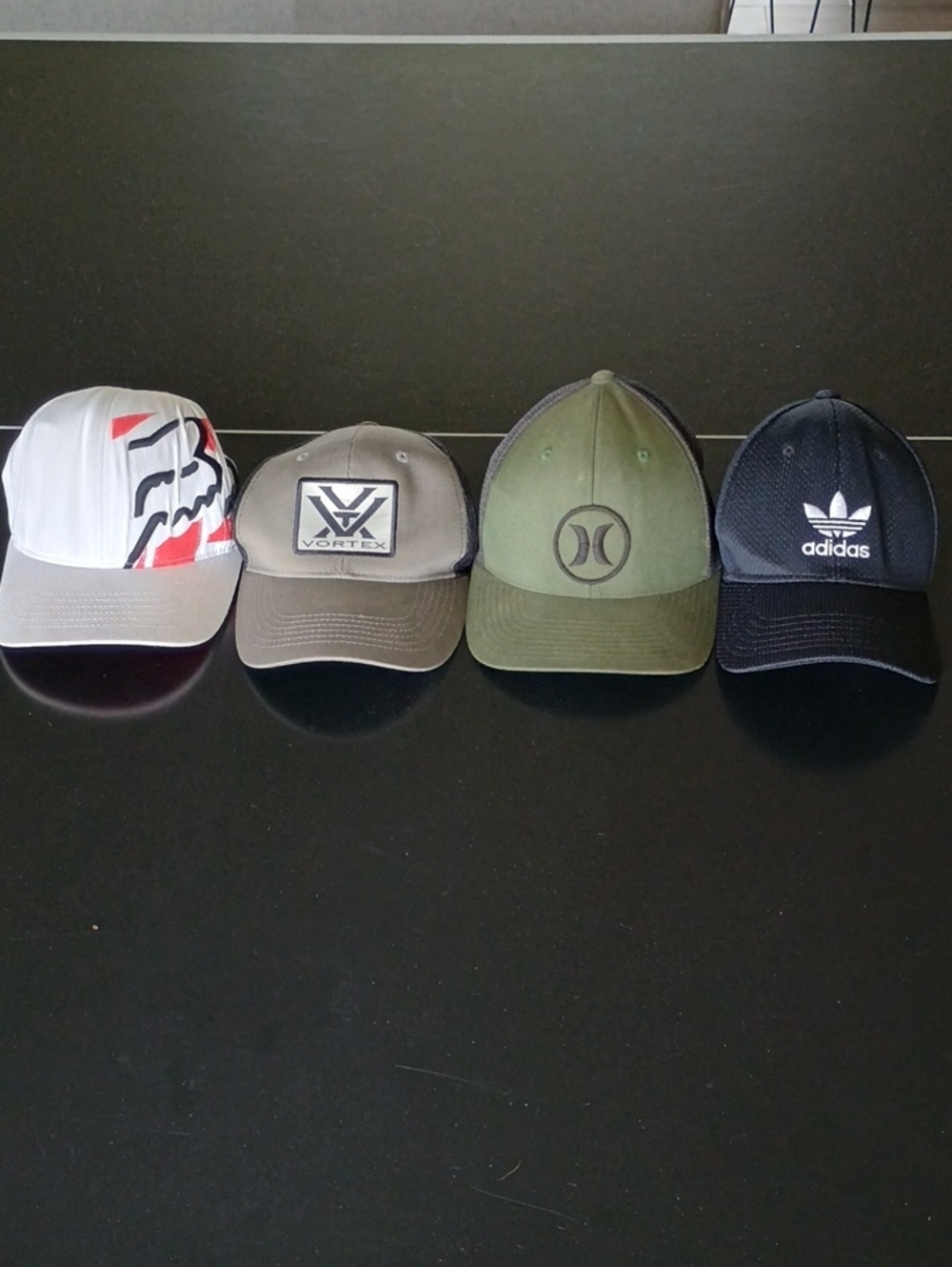 Four Men’s Baseball Caps — Fox, Vortex Hurley Adidas.